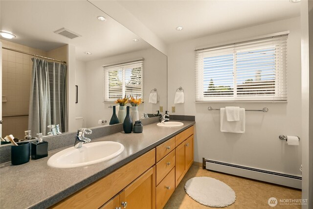 2325 38th Ave E, Seattle, WA 98112 - bathroom with baseboard heating, double vanity, curtained shower, and recessed lighting
