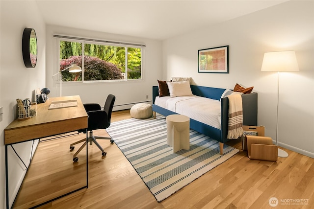 2325 38th Ave E, Seattle, WA 98112 - bedroom with wood finished floors, an office area, and baseboard heating