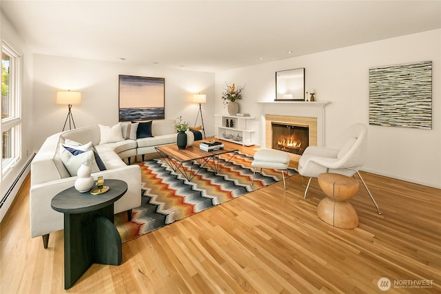 2325 38th Ave E, Seattle, WA 98112 - living area featuring light wood-type flooring and a glass covered fireplace