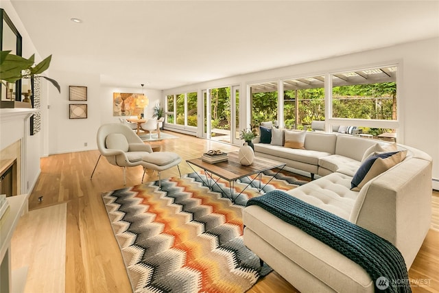2325 38th Ave E, Seattle, WA 98112 - living area featuring light wood finished floors, a tiled fireplace, and recessed lighting