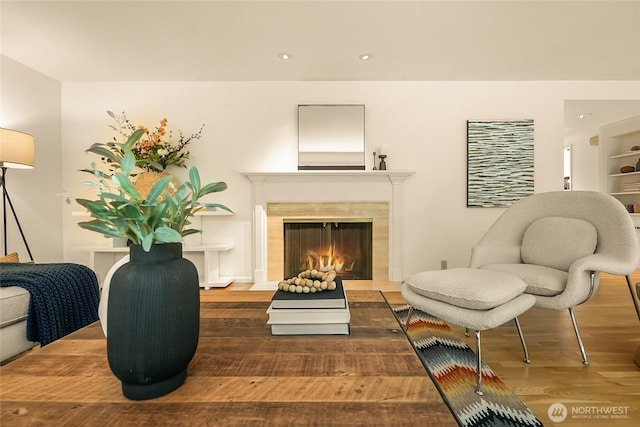 2325 38th Ave E, Seattle, WA 98112 - sitting room featuring wood finished floors, a fireplace with flush hearth, and recessed lighting