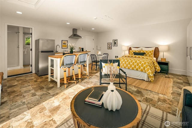 2325 38th Ave E, Seattle, WA 98112 - bedroom with freestanding refrigerator, recessed lighting, and stone finish floors
