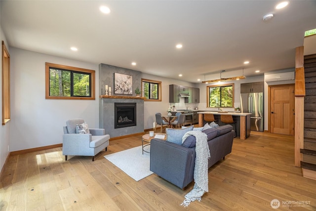 7489 Olsen Dr, Deming, WA 98244 - living area featuring a fireplace, recessed lighting, and light wood-style floors