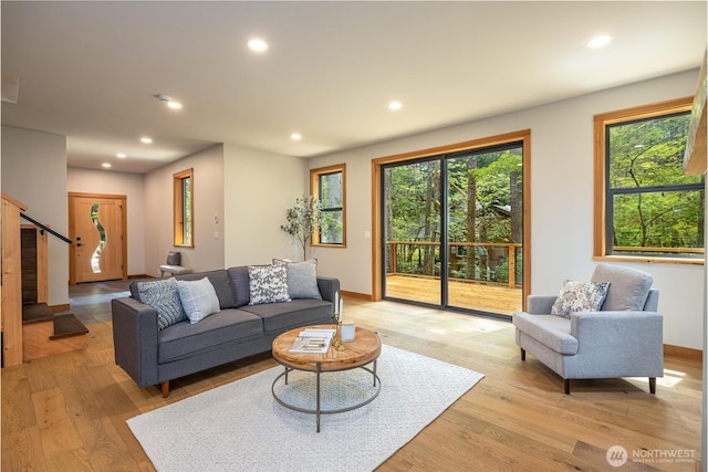 7489 Olsen Dr, Deming, WA 98244 - living room featuring healthy amount of natural light, recessed lighting, light wood-style flooring, and stairway