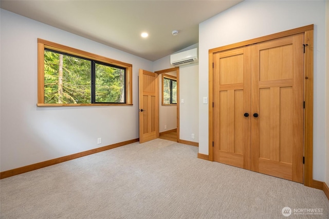 7489 Olsen Dr, Deming, WA 98244 - unfurnished bedroom featuring an AC wall unit, carpet flooring, and a closet