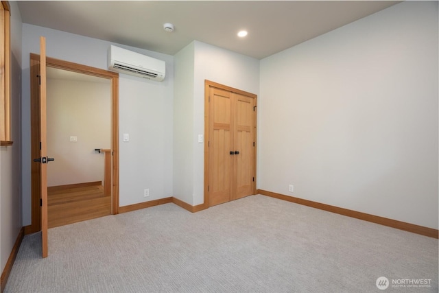 7489 Olsen Dr, Deming, WA 98244 - unfurnished bedroom with a wall mounted AC, light colored carpet, recessed lighting, and a closet