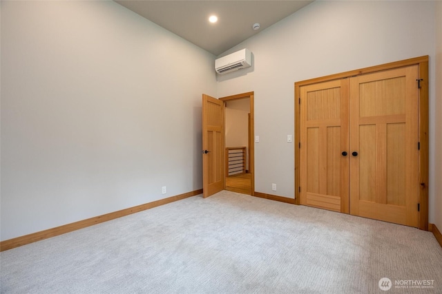 7489 Olsen Dr, Deming, WA 98244 - unfurnished bedroom with a wall mounted AC, high vaulted ceiling, carpet flooring, and a closet