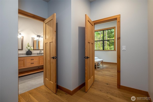 7489 Olsen Dr, Deming, WA 98244 - hallway featuring light wood-type flooring and a sink