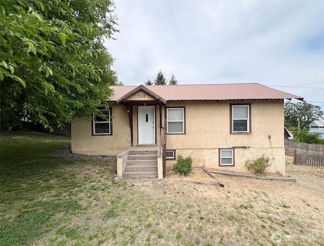 552 Maple St S, Okanogan, WA 98844 - view of front facade featuring stucco siding and a metal roof
