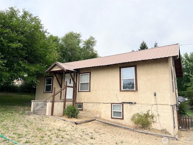 552 Maple St S, Okanogan, WA 98844 - view of front of home with a metal roof and stucco siding