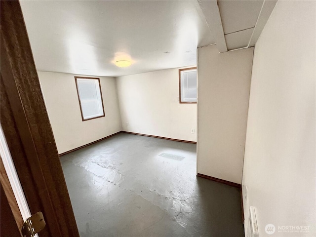 552 Maple St S, Okanogan, WA 98844 - spare room featuring unfinished concrete floors and baseboards