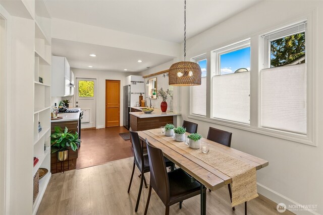 8608 12th Ave SW, Seattle, WA 98106 - dining room featuring wood finished floors and recessed lighting