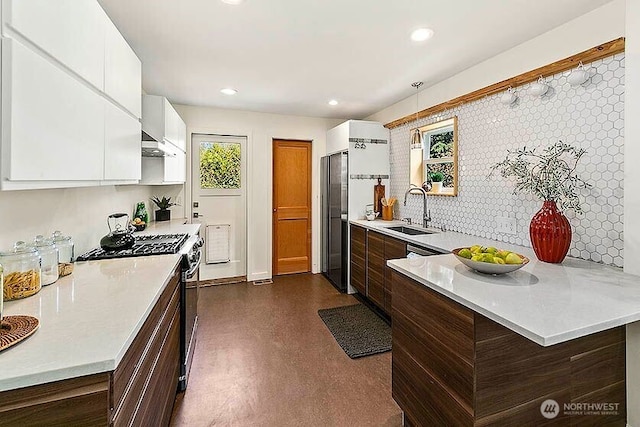 8608 12th Ave SW, Seattle, WA 98106 - kitchen featuring stainless steel gas range, modern cabinets, light countertops, white cabinetry, and recessed lighting