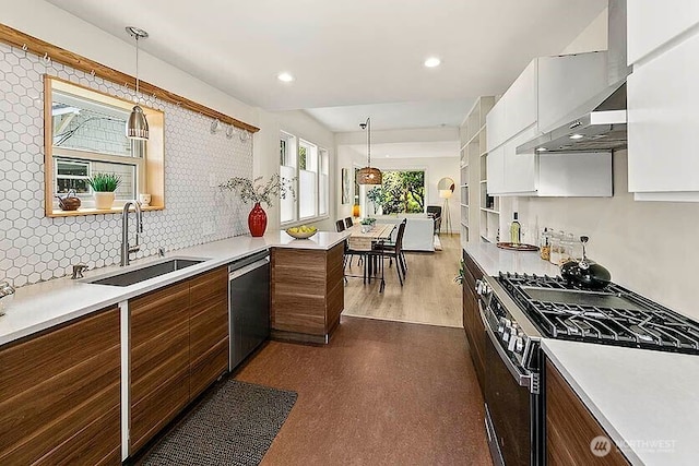 8608 12th Ave SW, Seattle, WA 98106 - kitchen with stainless steel appliances, white cabinetry, light countertops, pendant lighting, and recessed lighting