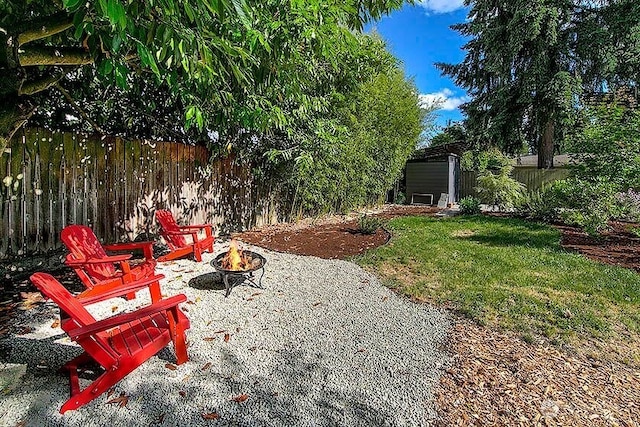 8608 12th Ave SW, Seattle, WA 98106 - view of yard featuring a fire pit and an outdoor structure