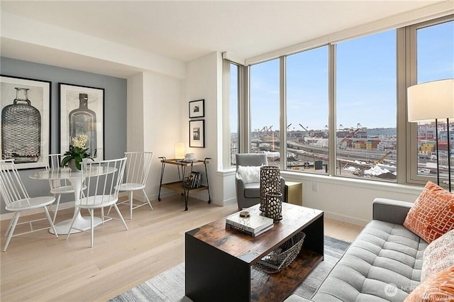590 1st Ave S Unit 907, Seattle, WA 98104 - living room with plenty of natural light and wood finished floors