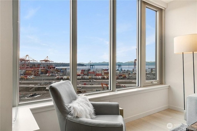 590 1st Ave S Unit 907, Seattle, WA 98104 - sitting room with wood finished floors and baseboards
