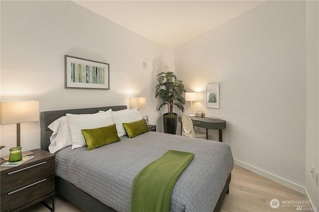 590 1st Ave S Unit 907, Seattle, WA 98104 - bedroom with wood finished floors and baseboards