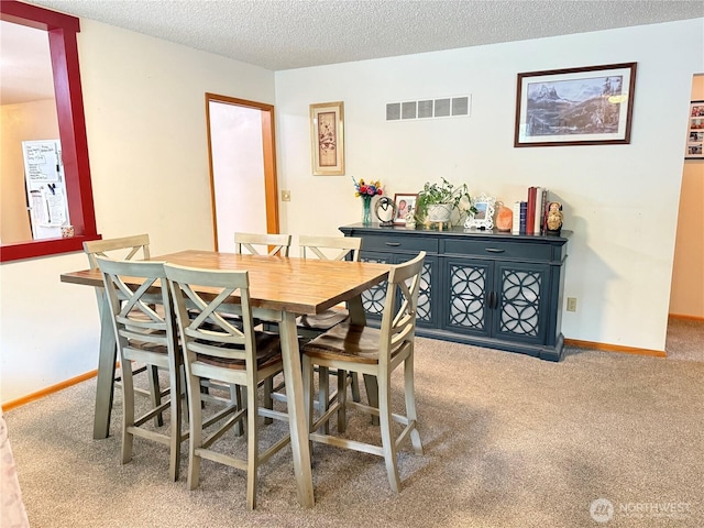 16 W Douglas St, Harrington, WA 99134 - dining room with carpet and a textured ceiling