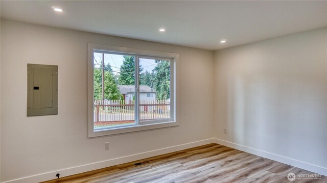 840 SW 306th St, Federal Way, WA 98023 - empty room with electric panel, recessed lighting, and light wood-style flooring