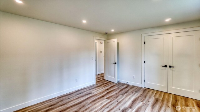840 SW 306th St, Federal Way, WA 98023 - unfurnished bedroom with light wood-type flooring, recessed lighting, and a closet