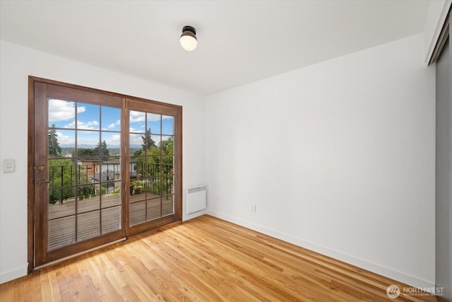 6024 Gould Ave S, Seattle, WA 98108 - unfurnished room with baseboards and light wood-style floors