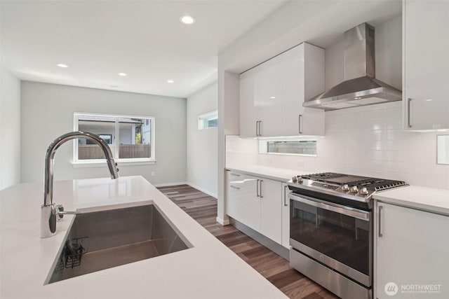 22939 Poplar Ave SE, Black Diamond, WA 98010 - kitchen with stainless steel range with gas cooktop, wall chimney exhaust hood, dark wood-style floors, white cabinets, and recessed lighting