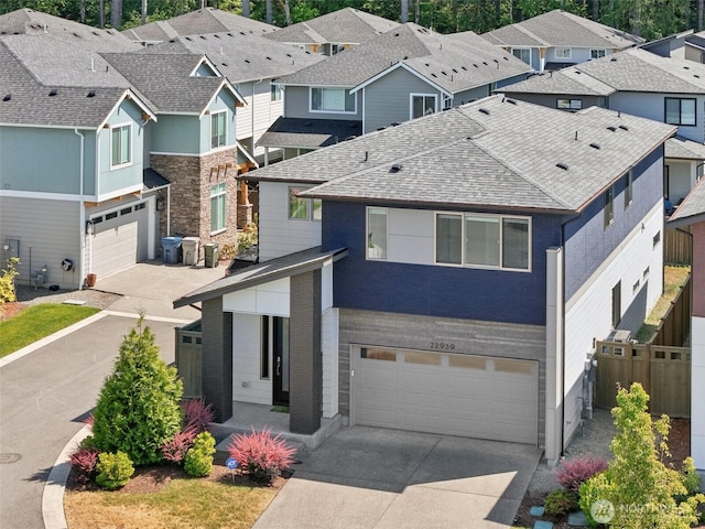 22939 Poplar Ave SE, Black Diamond, WA 98010 - view of front of home with an attached garage, concrete driveway, and a residential view