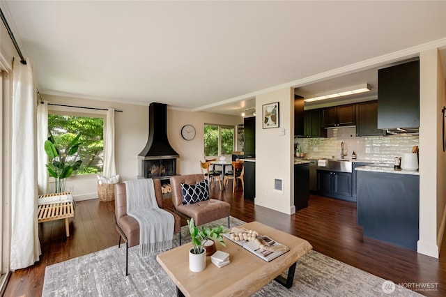 1110 E Harrison St Unit 301, Seattle, WA 98102 - living room with dark wood-style flooring and crown molding