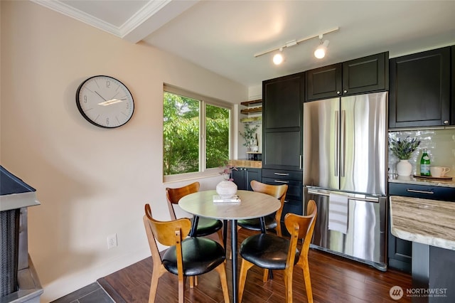 1110 E Harrison St Unit 301, Seattle, WA 98102 - dining area featuring dark wood-style floors, crown molding, and rail lighting