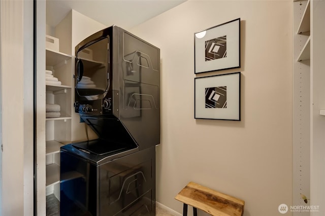 1110 E Harrison St Unit 301, Seattle, WA 98102 - laundry room with stacked washer / drying machine and baseboards
