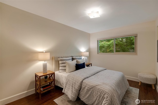 1110 E Harrison St Unit 301, Seattle, WA 98102 - bedroom featuring baseboards and wood finished floors