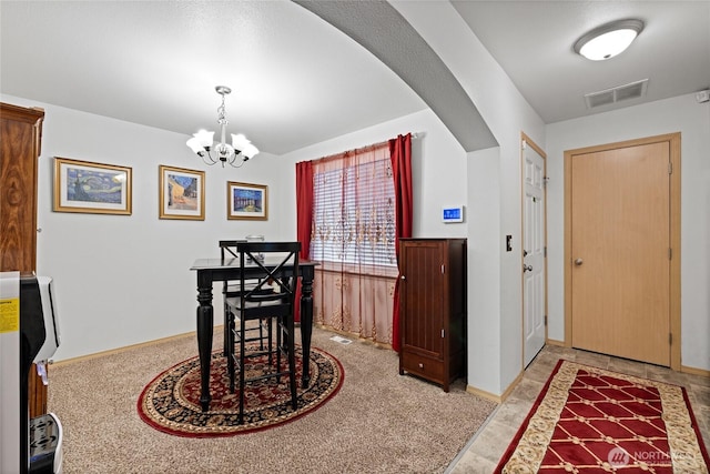 7230 178th St E, Puyallup, WA 98375 - dining area with a chandelier, arched walkways, and heating unit