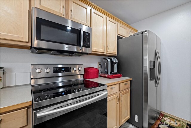 7230 178th St E, Puyallup, WA 98375 - kitchen featuring appliances with stainless steel finishes, light brown cabinets, and light countertops