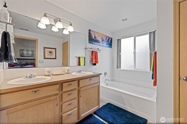 7230 178th St E, Puyallup, WA 98375 - bathroom featuring double vanity, a bath, and connected bathroom