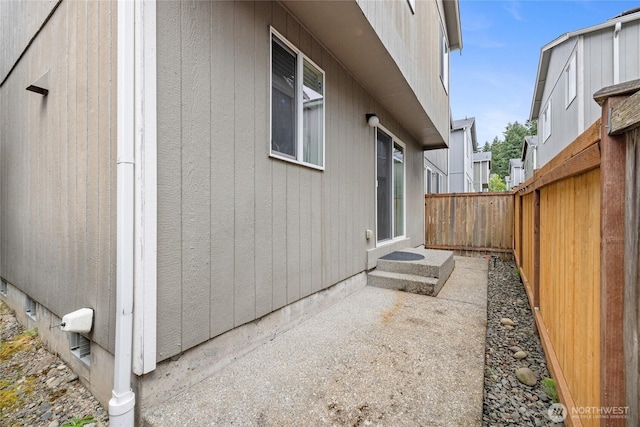 7230 178th St E, Puyallup, WA 98375 - view of side of home with a fenced backyard and a patio