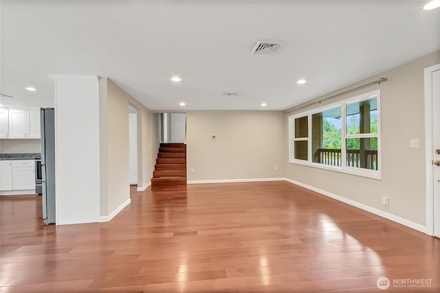 3005 Old Morse Rd SE, Olympia, WA 98501 - spare room with stairway, light wood-type flooring, and recessed lighting