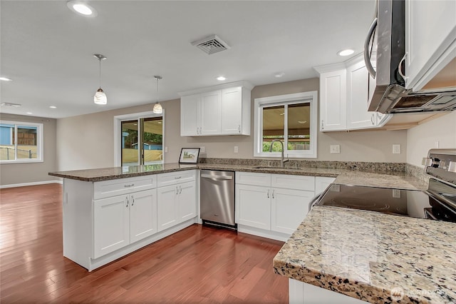 3005 Old Morse Rd SE, Olympia, WA 98501 - kitchen featuring appliances with stainless steel finishes, a peninsula, dark wood-style flooring, white cabinetry, and recessed lighting