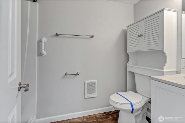3005 Old Morse Rd SE, Olympia, WA 98501 - bathroom with vanity, heating unit, and wood finished floors