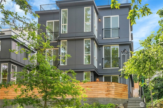 629A W Emerson Ave, Seattle, WA 98119 - contemporary house featuring a balcony and stucco siding