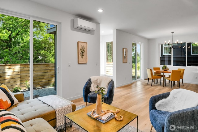629A W Emerson Ave, Seattle, WA 98119 - living area featuring a wall mounted AC, a chandelier, recessed lighting, and light wood-type flooring
