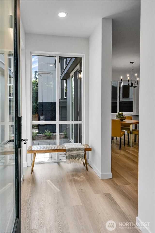 629A W Emerson Ave, Seattle, WA 98119 - corridor featuring wood finished floors, healthy amount of natural light, a chandelier, and recessed lighting