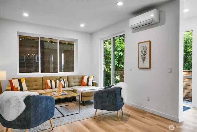 629A W Emerson Ave, Seattle, WA 98119 - living area with a wall mounted AC, light wood-type flooring, and recessed lighting