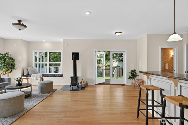 2414 42nd Pl, Anacortes, WA 98221 - living room featuring a wood stove, light wood-style floors, and recessed lighting