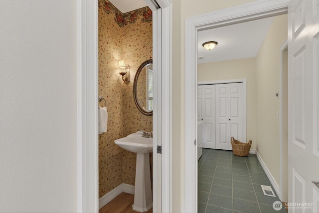 2414 42nd Pl, Anacortes, WA 98221 - bathroom featuring wallpapered walls and tile patterned flooring