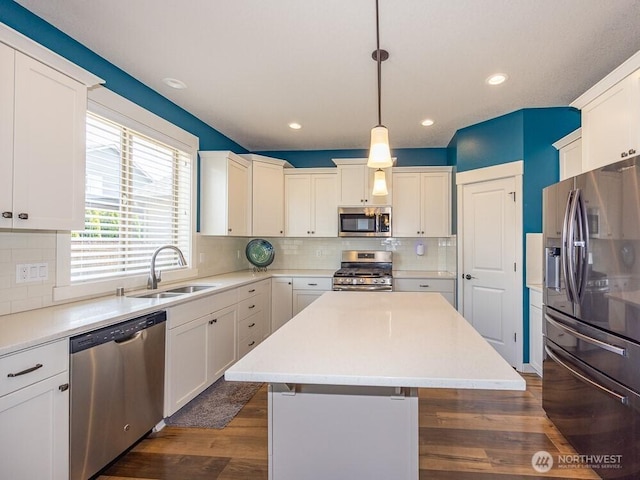 11217 NE 134th Pl, Vancouver, WA 98682 - kitchen featuring stainless steel appliances, a kitchen island, decorative backsplash, light countertops, and recessed lighting