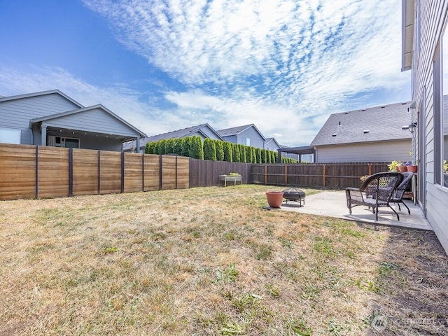 11217 NE 134th Pl, Vancouver, WA 98682 - fenced backyard with a patio and an outdoor fire pit
