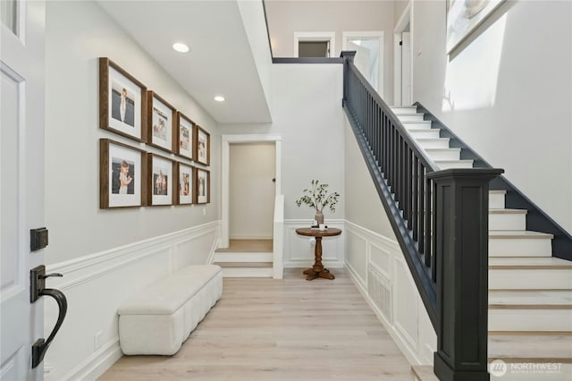 17519 33rd Ave NE, Lake Forest Park, WA 98155 - foyer entrance with a wainscoted wall, recessed lighting, light wood finished floors, stairs, and a decorative wall