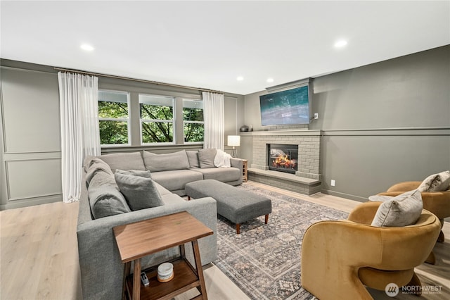 17519 33rd Ave NE, Lake Forest Park, WA 98155 - living room with wood finished floors, a fireplace, and recessed lighting