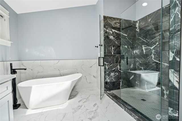 17519 33rd Ave NE, Lake Forest Park, WA 98155 - full bathroom featuring a freestanding bath, a marble finish shower, vanity, a wainscoted wall, and marble finish floors